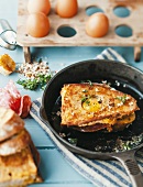 Fried bread with salami and egg