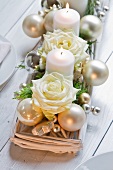 Advent arrangement of white candles and roses