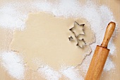 Rolled Out Sugar Cookie Dough with Star Cookie Cutters and a Rolling Pin