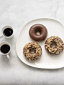 Dark Chocolate Covered Donuts; Two with Chopped Hazelnuts