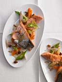 Marinated trout fillets with vegetables and pine nuts