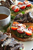 Bruschetta topped with biltong and tomatoes
