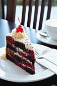 A slice of checked red velvet cake