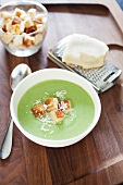 Bowl of Broccoli Cheddar Soup with Croutons; Cheese on Grater