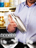A barman mixing a Martini