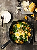 Fried potato and spinach with fried egg
