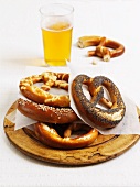 Various lye bread pretzels and a glass of beer