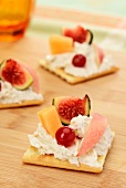 Canapes with cheese cream and fruit