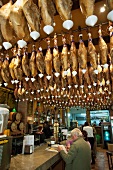 Legs of ham hanging in a tapas bar