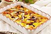 Breakfast Casserole with Egg, Sardines, Bacon and Olives
