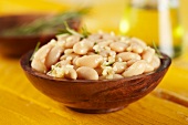 Wooden Bowl of White Beans with Garlic