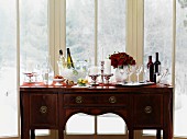 A wine buffet on an antique chest of drawers