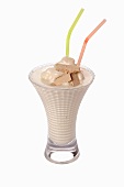 An ice cream shake with straws