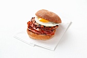A burger with bacon and a fried egg