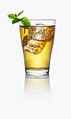 Apple juice spritzer with ice cubes and mint