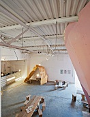 Seating areas made from homemade stools and a kitchen counter in the Loft (The Yard Theatre, London)