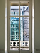 View through closed balcony doors of the modern house next door (Goethe Institut, London)