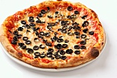 A Pizza Margherita topped with black olives