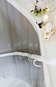 Flowers, candle and animal skull decorating stairwell