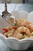 White beans with celery, pepper and prawns