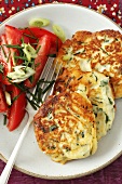 Ricotta cakes with chives and a tomato salad
