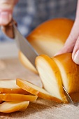Scamorza being sliced