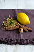 A lemon and various spices