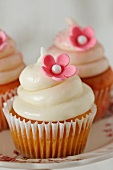 Vanilla Cupcakes with Pink Flower Decoration