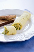 French Omelet on a White Plate with Whole Wheat Toast