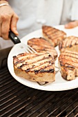 Placing Grilled Tuna Steaks on a Platter