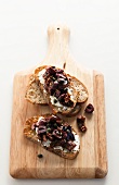 Bread Topped with Cheese and Olive Tapenade