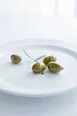 Green olives on a plate