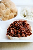 Barbecue Pulled Pork Sandwich in a Styrofoam To-Go Box with Cole Slaw