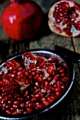 Pomegranates, whole and cut open