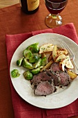Sliced Beef Tenderloin with Roasted Potatoes and Pan Sauteed Brussels Sprouts