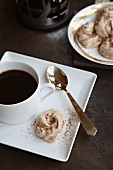 Chocolate Meringue Cookie with a Cup of Coffee