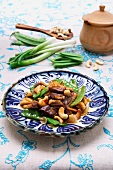 Stir-fried duck with mange tout and cashew nuts