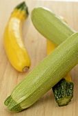 Two light green and two yellow courgettes