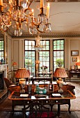 Pair of urns converted into lamps on Regency coffee table in neoclassical salon