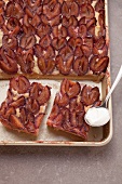 Plum cake on a baking tray