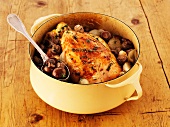 Chicken with mushrooms in a pot