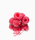 Raspberries on a wet mirror