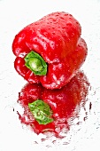A red pepper on a wet mirror