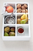 Assorted varieties of pear in a wooden box