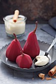 Pears poached in red wine, with vanilla cream