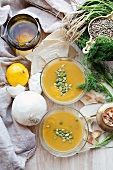 Pumpkin soup with unleavened bread and various ingredients