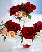 Roses in crystal dishes as table decorations