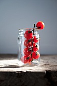 Fresh cherry tomatoes in a jar
