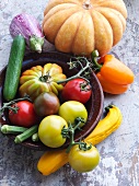 An arrangement of vegetables with tomatoes and pumpkins