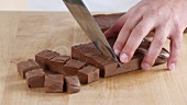Chocolate fudge being diced